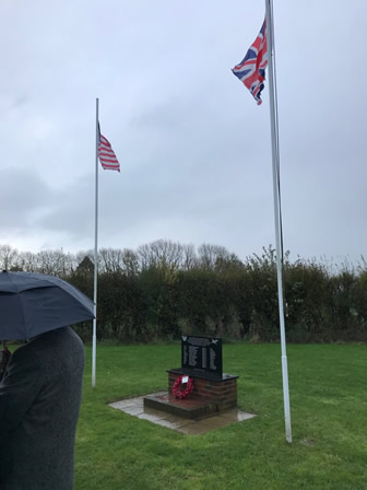 Memorial, flags and heavy rain